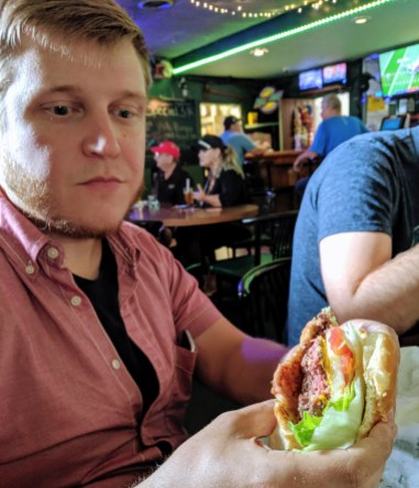 Erik proudly shows off his newborn burger.